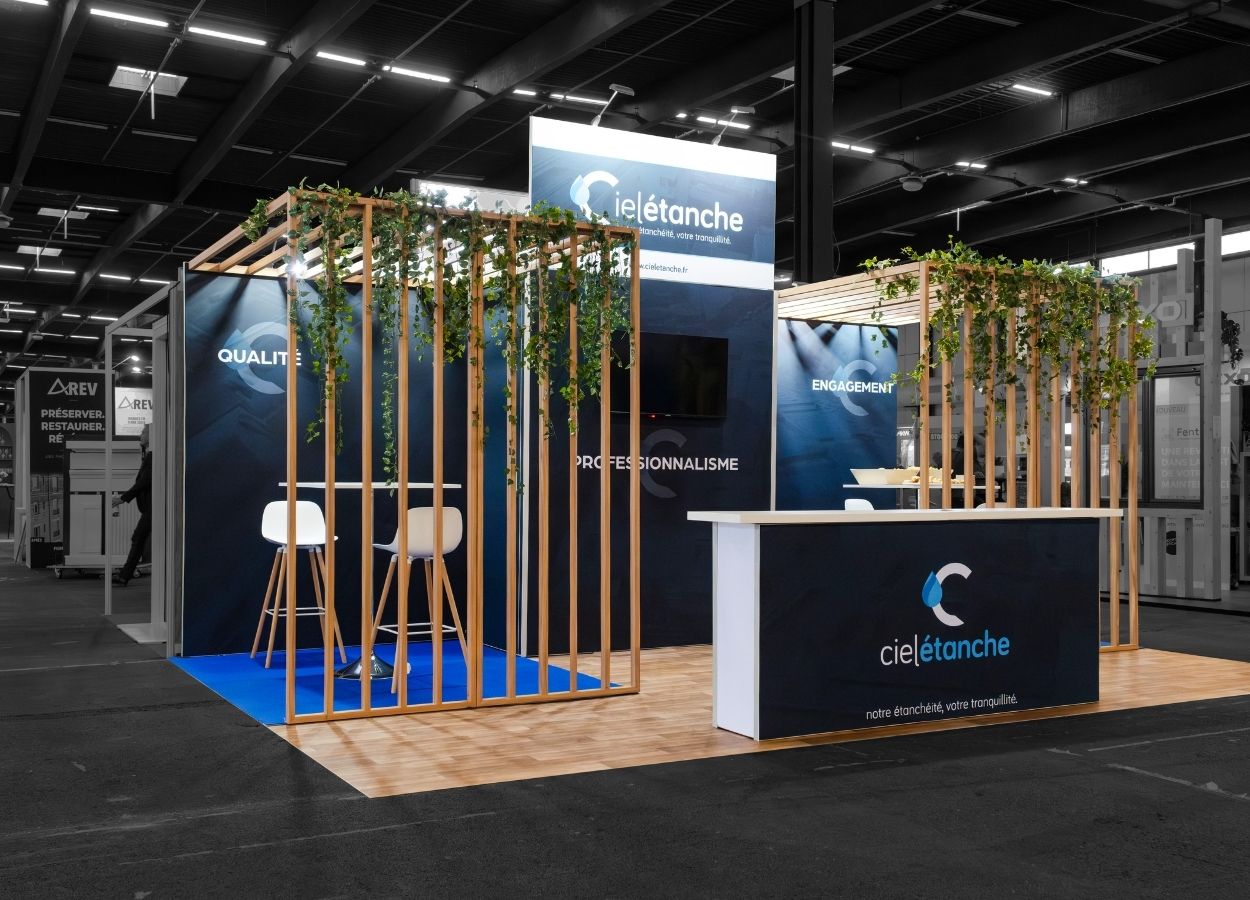 Modular Sky Ciel Stand at H'Expo 2026, overview with wooden arches and greenery – The Modular Stand